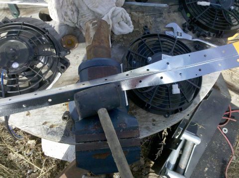 1979 Ford Bronco - Tools and electric fans are laid out on a wooden surface, possibly for a project.
