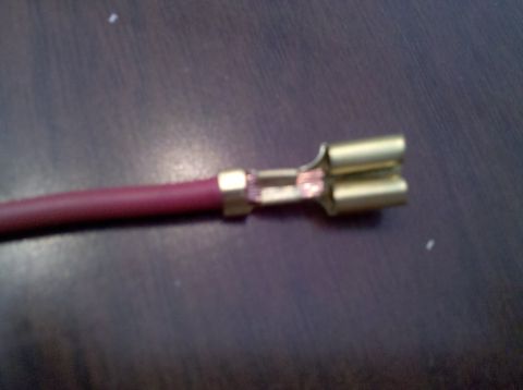 1979 Ford Bronco - Electrical wire with a brass spade connector attached.