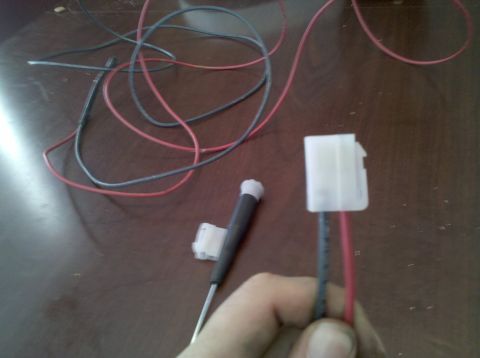 1979 Ford Bronco - Electrical wiring and connectors are laid out on a table, possibly for installation or repair.