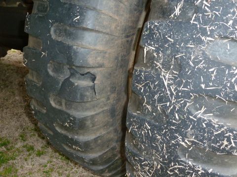 1992 Ford Mustang - Close-up of two tires, one showing significant damage to its sidewall.