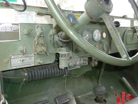 1992 Ford Mustang - Interior view of a military truck's dashboard, various controls and gauges.