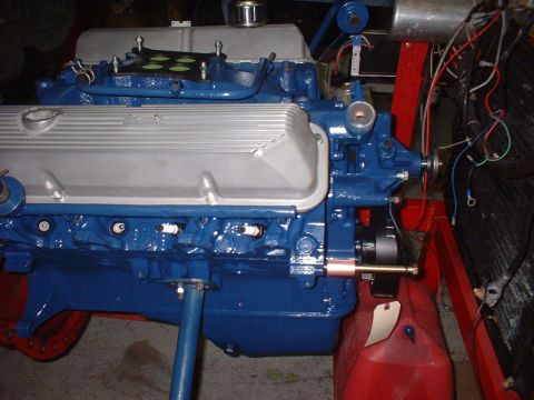 1969 Mercury Cyclone - Close-up of a blue engine assembly with silver valve covers and visible spark plugs.