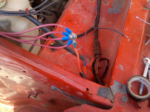 1979 Ford Bronco - Close-up of engine bay wiring harness connections, showing multiple red wires connected to a central point.