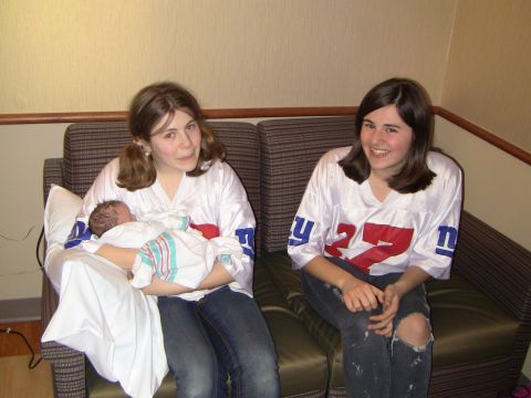 1978 Ford Bronco - A proud moment captured as two women in New York Giants jerseys cradle a newborn baby.