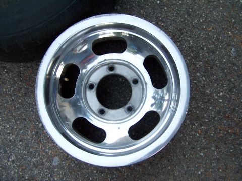 1973 Ford Bronco - A single aluminum alloy wheel is shown, with a tire partially visible in the upper left corner.