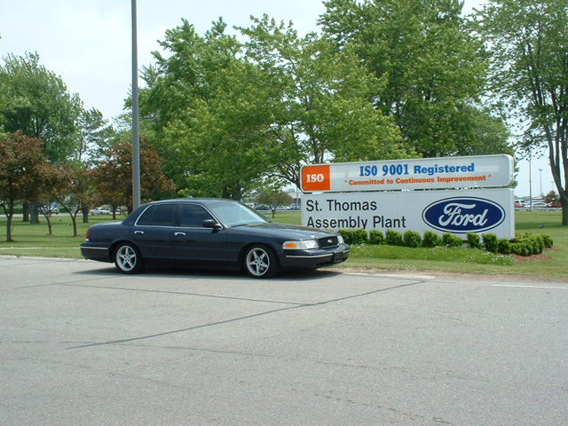 Dark blue Ford Crown Victoria parked by the St. Thomas Assembly Plant Ford sign
