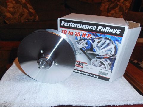 1990 Ford Bronco - A polished pulley sits beside its "Performance Pulleys" box, indicating a 10 to 15 horsepower rating.