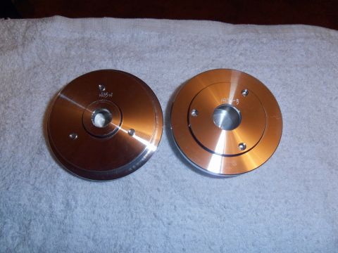 1990 Ford Bronco - Two machined metal pulleys, labeled 1435-A and 1435-B, are displayed on a white towel.