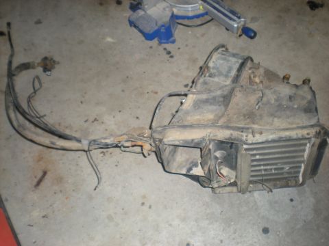 1978 Ford Bronco - This is a disassembled automotive heating and cooling unit, likely removed for repair or replacement.