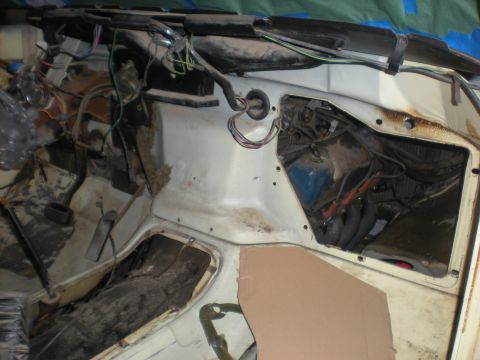 1978 Ford Bronco - Firewall and engine bay of a vehicle, showing wiring and mechanical parts.