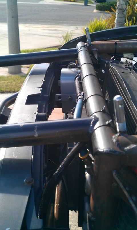 1992 Ford Ranger - Custom roll cage tubing is installed around the radiator and fan in the engine bay.