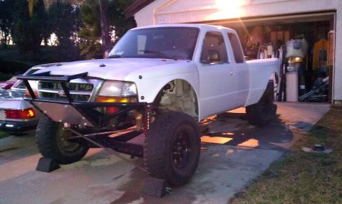 1992 Ford Ranger - This 1992 Ford Ranger features a custom front bumper and a lifted suspension, suggesting off-road modifications.