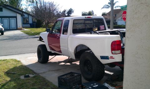 1992 Ford Ranger - This Ford Ranger pickup truck appears to be from the late 1990s, not 1992, with a two-tone paint job and modified suspension.
