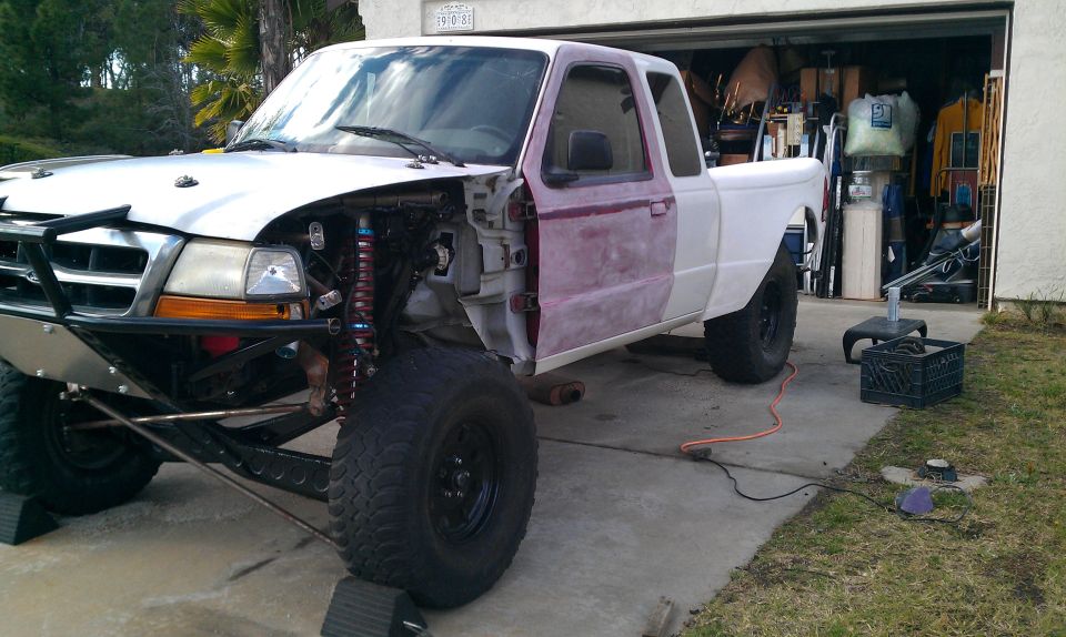 1992 Ford Ranger with front end disassembled, showing suspension and engine bay components
