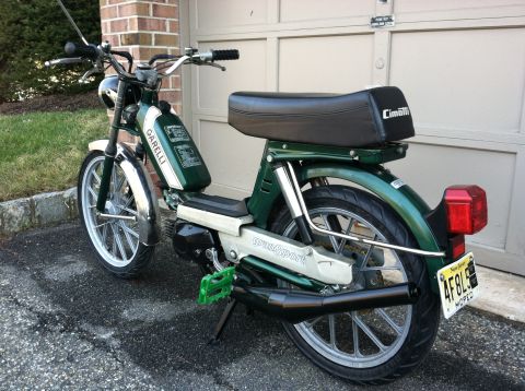 1981 Garelli Rally Sport - This green moped features 'GranSport' branding on its side and 'Garelli' on the fuel tank, with a black seat and chrome accents.