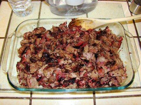 1989 Ford Bronco - Shredded smoked meat in a glass dish, ready to be served.