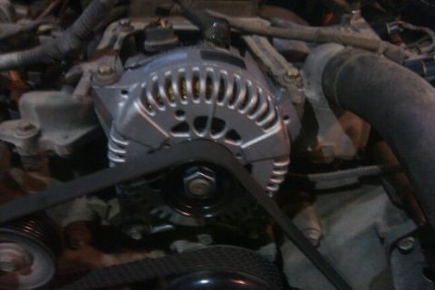 2000 Mercury Grand Marquis - Engine bay view showing the alternator and drive belt system.