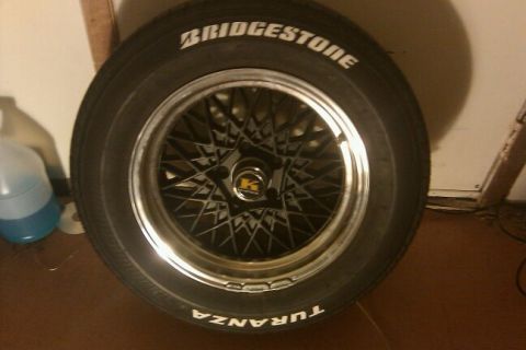 2000 Mercury Grand Marquis - A close-up of a tire and wheel assembly, Bridgestone branding on the tire.