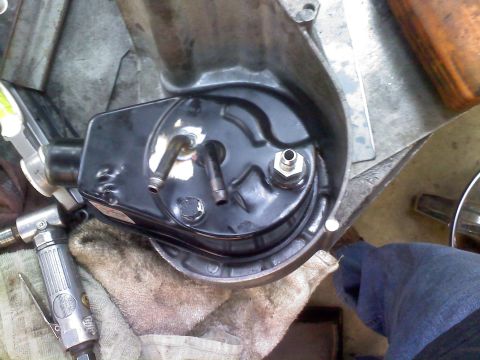 1996 Ford Bronco - Close-up of a power steering pump assembly, likely during a repair or rebuild process.