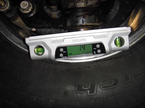 1995 Ford Bronco - A digital level is used to measure the angle of a vehicle's tire and suspension components.