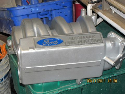 1985 Ford F-150 - A Ford intake manifold with "ELECTRONIC FUEL INJECTION" text is shown.