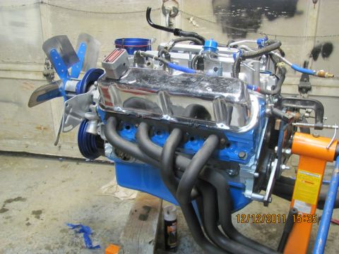 1985 Ford F-150 - Engine on stand with chrome valve covers and headers, date stamp 12/12/2011.