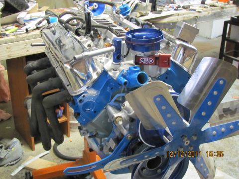 1985 Ford F-150 - Engine assembly with MSD ignition and fan, mounted on an engine stand.