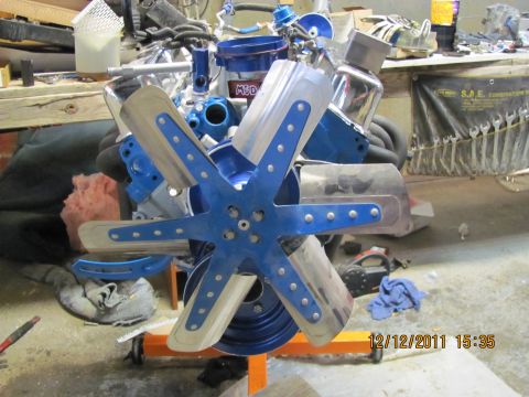 1985 Ford F-150 - Engine with blue fan and chrome accents, possibly a new build. MSD branding is visible on a component.