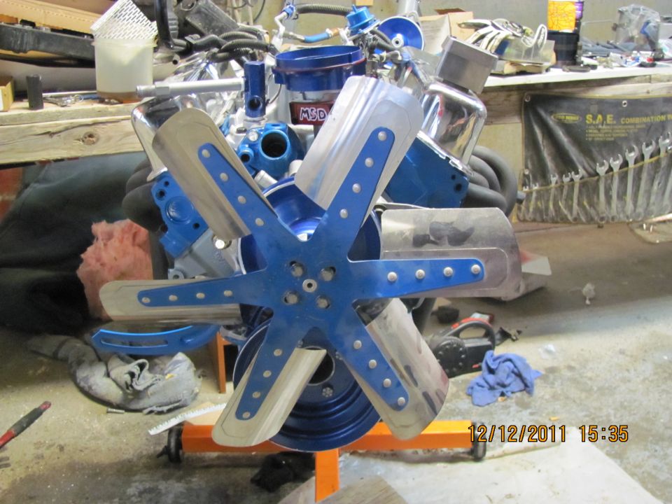 Blue six-blade fan on a chrome and blue engine with MSD branding