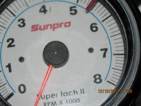 1985 Ford F-150 - A close-up of a Sunpro tachometer gauge, showing RPM readings and "Super tach II" text.