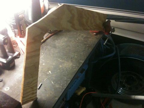 1978 Chevrolet Camaro - Workbench setup with a wooden template being held by a vise, tools visible.