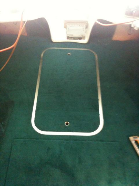 1978 Chevrolet Camaro - The image shows the interior of a boat, focusing on the carpeted floor with a large rectangular cutout.