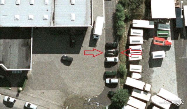 Aerial view of parked cars and trailers