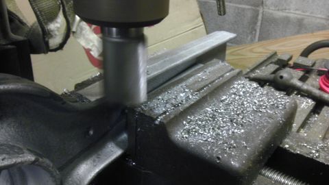 1987 Ford Ranger - Metalworking in progress: a milling machine cuts into a workpiece secured in a vise.