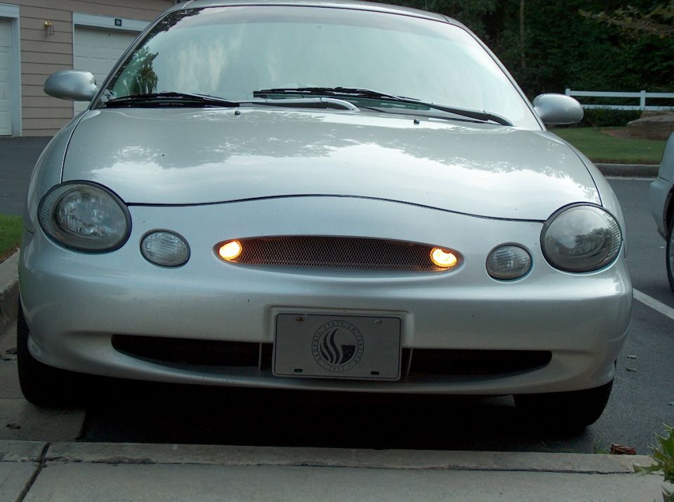 1998 Ford Taurus front view, silver paint, grille with amber turn signals