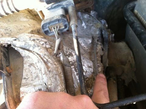 1997 Ford F-250 - Close-up view of damaged engine compartment insulation and electrical connectors.