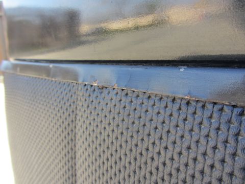 1964 Ford Ranchero - Detail of a textured panel with some paint chipping on the trim above.