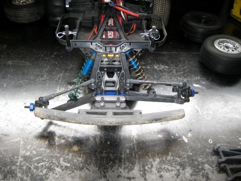 1996 Ford Bronco - Close-up view of the front suspension and bumper assembly of an RC car.