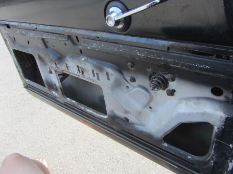 1964 Ford Ranchero - Interior view of a car door, showing the window mechanism and structural components.