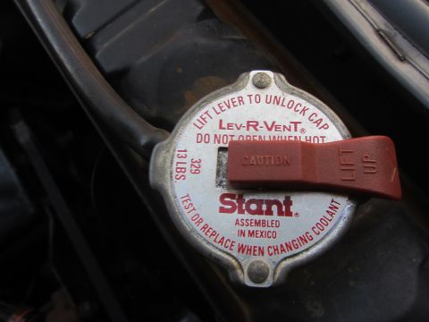 1964 Ford Ranchero - A Stant radiator cap with a red lever is shown, indicating it is a Lev-R-Vent model.