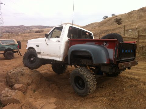 1989 Ford Bronco - This 1989 Ford Bronco is shown off-road with large tires and a lifted suspension.