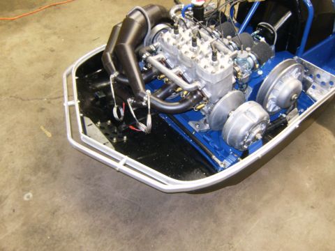 2000 Ford E350 - Close-up view of a snowmobile's engine and primary clutch assembly.