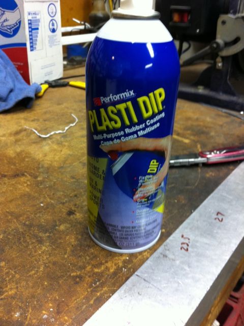 2010 Dodge Challenger - Performix Plasti Dip can sits on a workbench next to a ruler and tools.