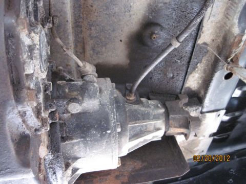 1979 Ford Bronco - Underside view of a vehicle's drivetrain, showing the transfer case and related components.