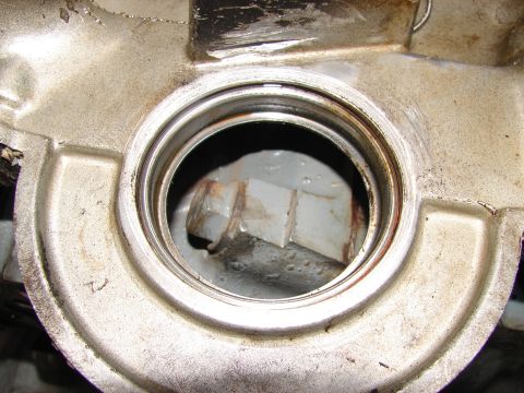 1973 Ford Ranchero - Engine part with a bolt inside a circular opening, likely from a vehicle.
