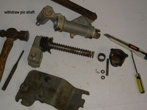 1983 Ford Bronco - The shaft can now be rotated (if necessary) to withdraw it from the shift lever tube. Collect the lower slide bushing, which may remain in…