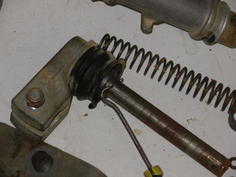 1983 Ford Bronco - Gently pry each retainer tab up SLIGHTLY to reduce its grip on the shaft, then slide it off the shaft.