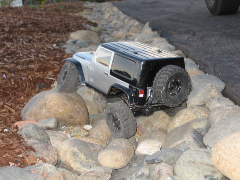 RC Jeep rock crawler navigating a rocky path