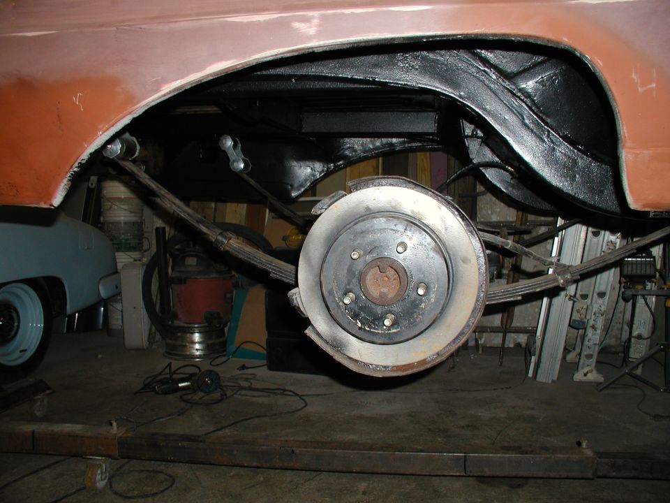 1960 Ford Ranchero rear suspension and wheel well with leaf springs and brake rotor