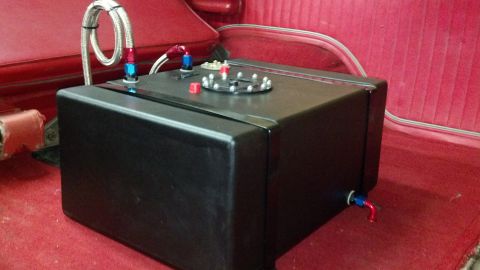 1978 Ford Bronco - Aftermarket fuel cell with braided lines and fittings is visible inside a vehicle.